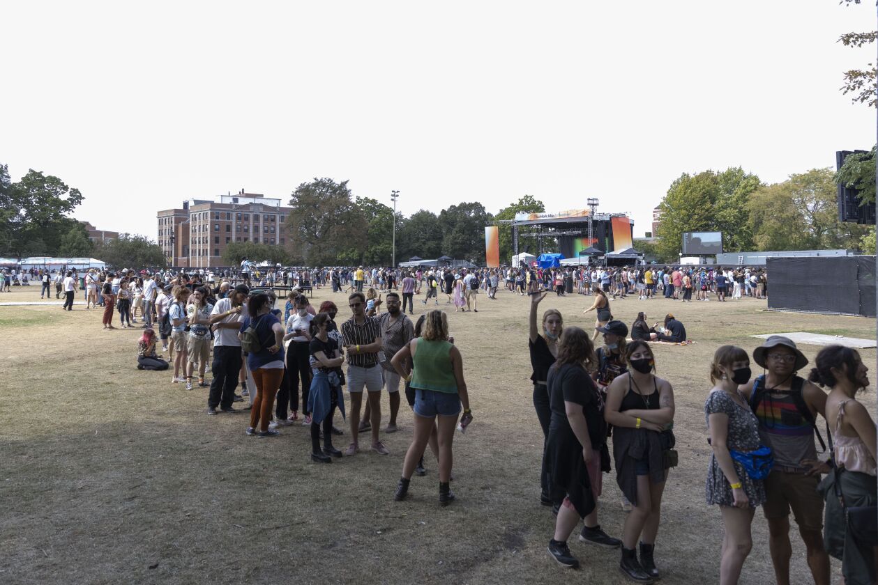Festival goers wait in line buy a t-shirt on Day 1 of the Pitchfork Music Festival on Friday in Union Park.